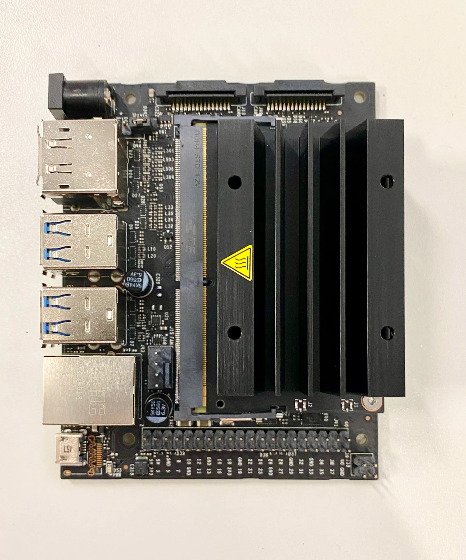 An NVIDIA Jetson Nano 2 development board, a small single-board edge AI computer, photographed against a neutral background
