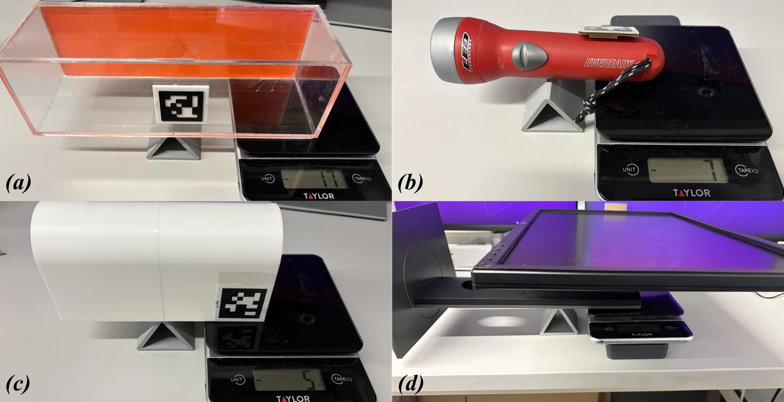 Four-panel laboratory photograph showing an acrylic box, flashlight, heart-shaped object and computer monitor balanced on small pivots beside digital scales.