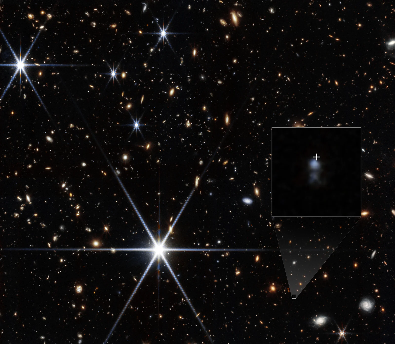 Webb NIRCam image showing the faint dwarf host galaxy of fast radio burst FRB 20240304B, with an inset zoom and a white crosshair marking the burst location